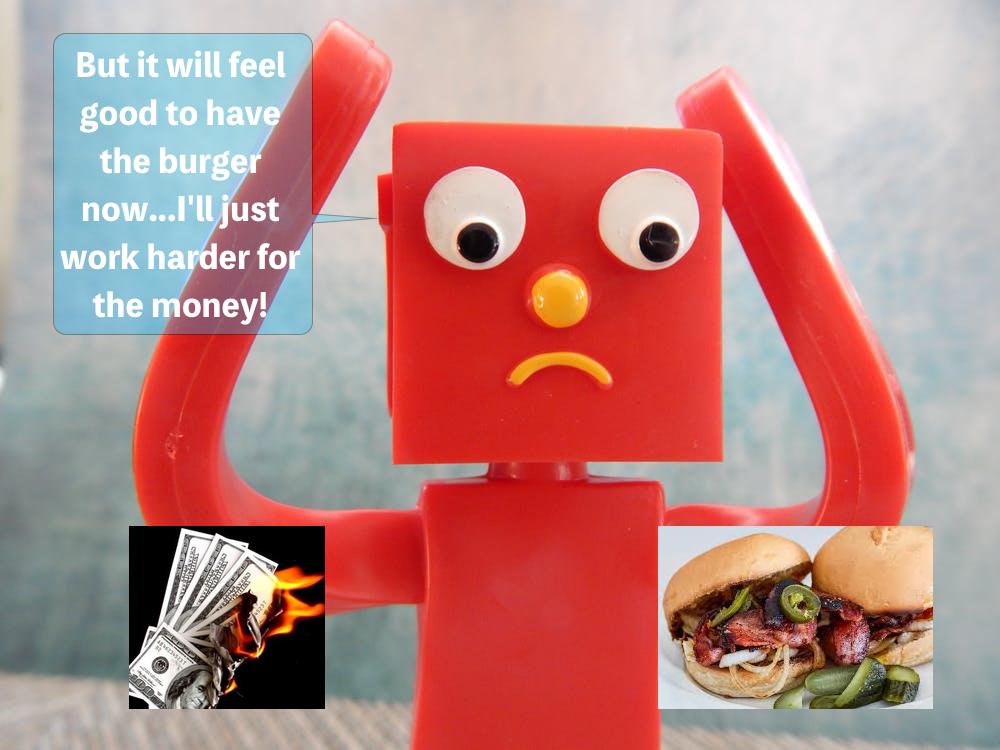Picture of toy trying to decide between a burger or money that's on fire