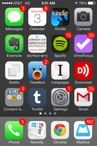 Image of iPhone screen showing red notification circles on a lot of apps